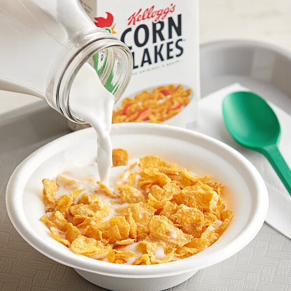 A bowl of Kellogg's Corn Flakes cereal with milk.