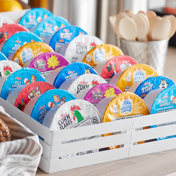A group of colorful packages of Kellogg's cereal bowls.