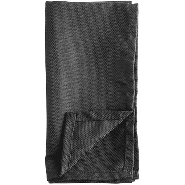 A folded black Oxford cloth napkin.