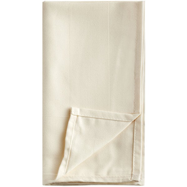 A white folded Oxford Ivory cloth napkin.