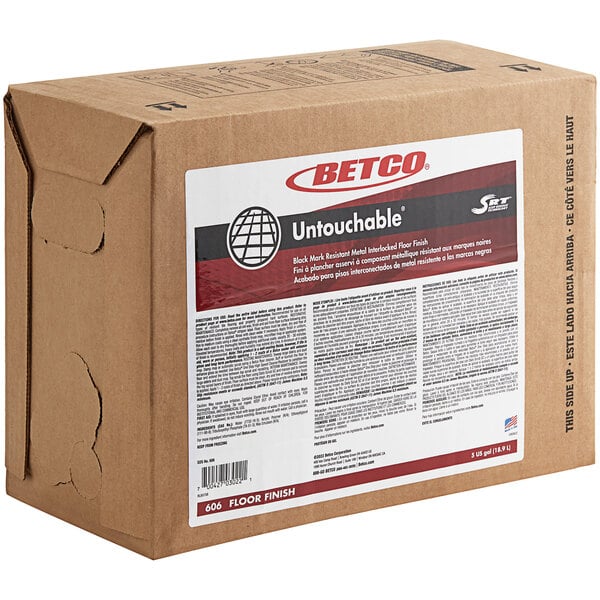 A brown Betco box with white and red text for "Betco Untouchable 5 Gallon Bag in Box Floor Finish" on a counter.