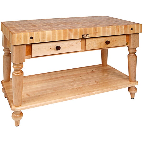 A John Boos wooden kitchen island with drawers.
