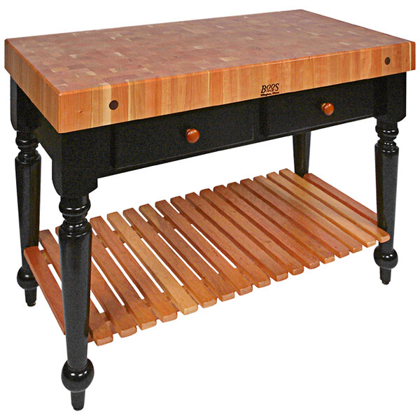 A John Boos wooden kitchen island with two drawers.