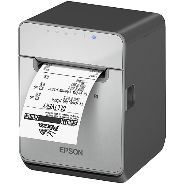 An Epson black thermal label printer with USB, Ethernet, and Bluetooth connectivity printing a label.
