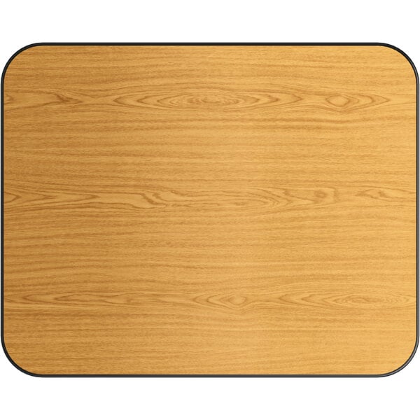 A Lancaster Table & Seating rectangular wood table top with black edges.