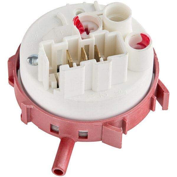 A close up of a Main Street Equipment simple pressure switch with a white and red plastic nut and white and red device.