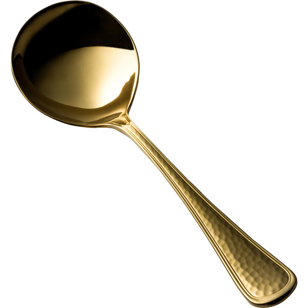 A Bon Chef gold bouillon spoon with a handle.