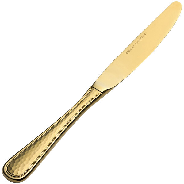 A Bon Chef gold European dinner knife with a handle.