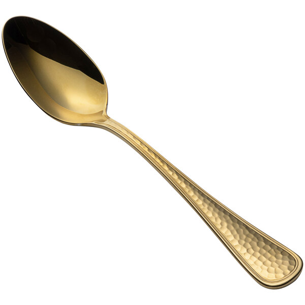 A Bon Chef stainless steel teaspoon with a gold handle on a white background.