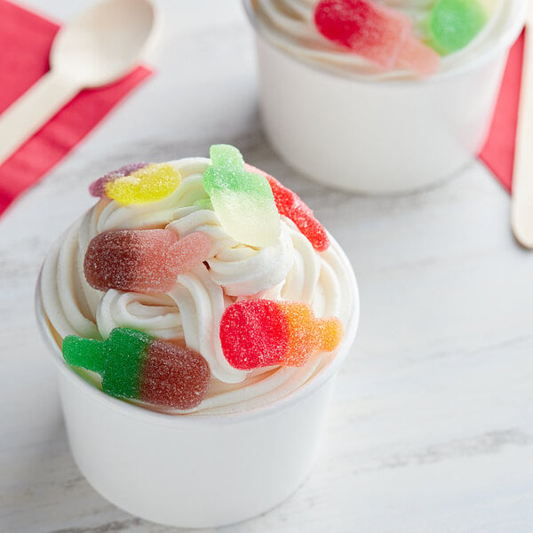 A cup of ice cream with Vidal Gummy Ice Pops on top.