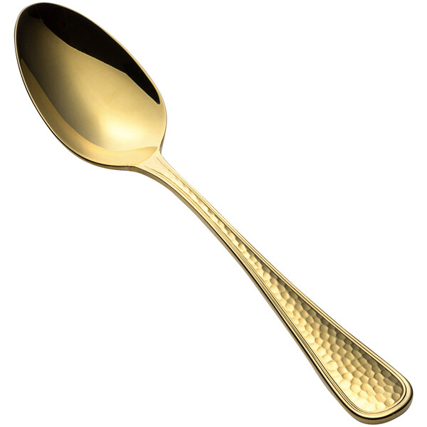 A Bon Chef stainless steel oval bowl spoon with a gold handle.