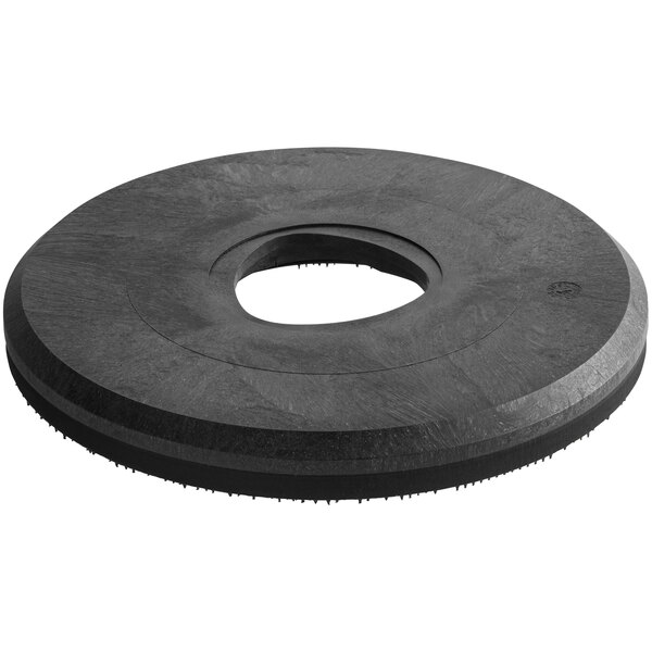 A black rubber circular pad with a hole in the middle.