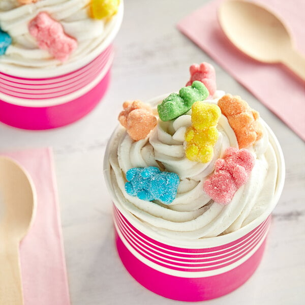 A cupcake with Kervan neon gummy bears on top.