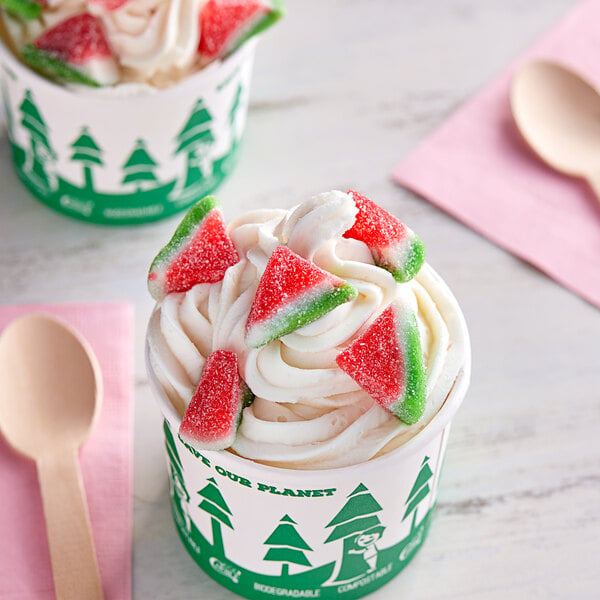 A cup of ice cream with Kervan Gummy Watermelon slices on top.