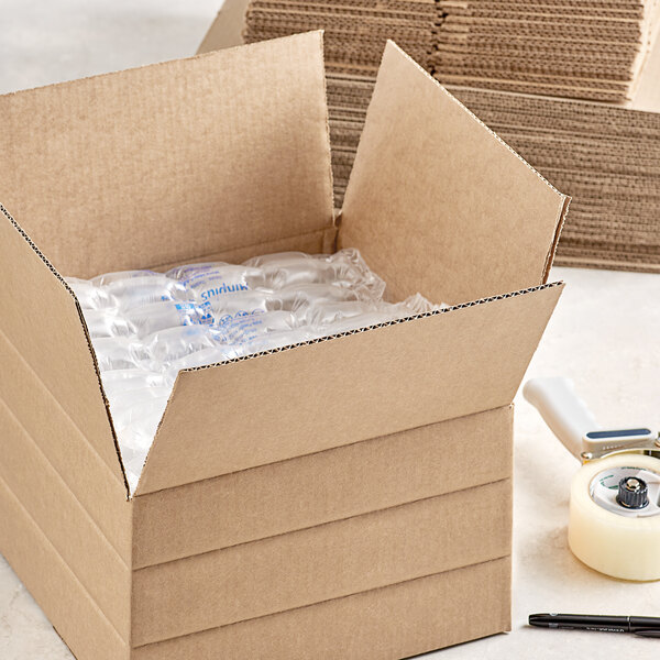 A Lavex corrugated shipping box filled with plastic bottles.