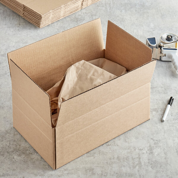 A Lavex kraft cardboard shipping box with a paper bag inside.