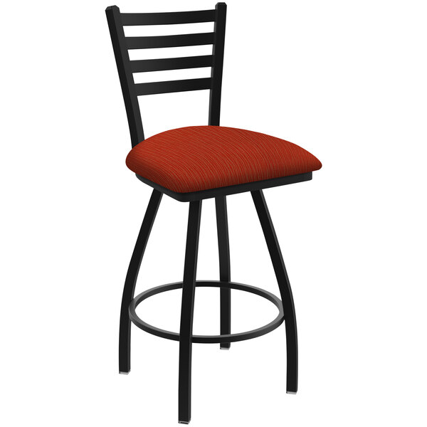A black Holland Bar Stool ladderback swivel bar stool with a red and black graph poppy cushion.