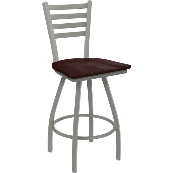 A Holland Bar Stool Jackie Ladderback Swivel Bar Stool with a dark cherry maple seat and an anodized nickel frame.