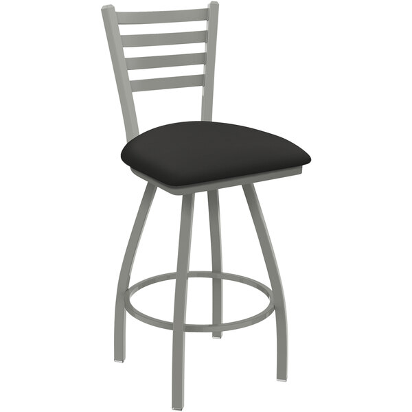 A black Holland Barstool Jackie ladderback swivel bar stool with a black iron seat.