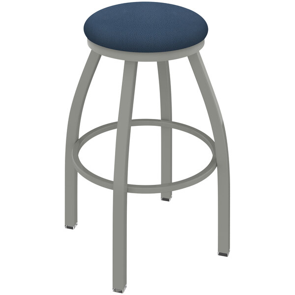 A Holland Bar Stool Misha swivel bar stool with a blue seat and anodized nickel frame.