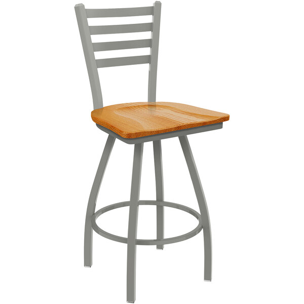 A Holland Bar Stool Jackie ladderback counter stool with a medium oak seat.