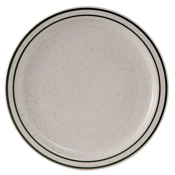 A Tuxton white china plate with a black speckled rim.