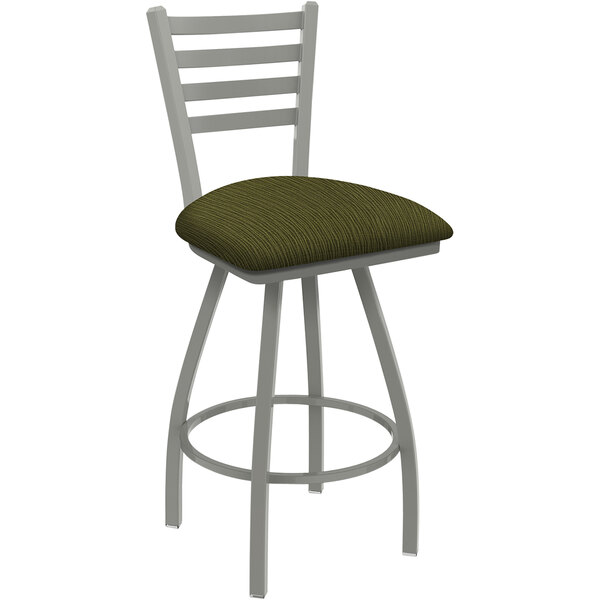 A Holland Bar Stool ladderback counter stool with a green cushion.