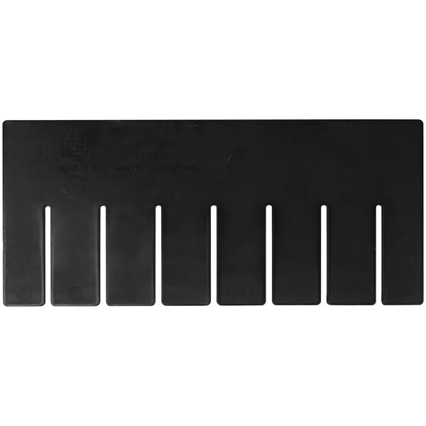A black plastic board with rows of holes.