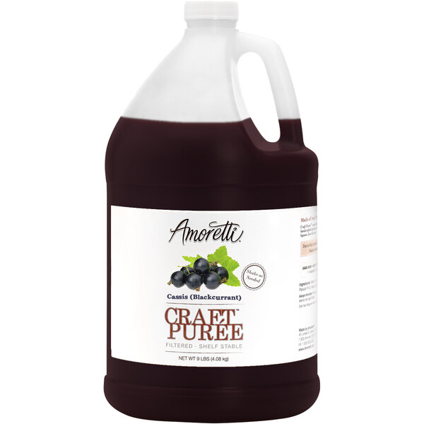 A jug of Amoretti black currant craft puree with a label.