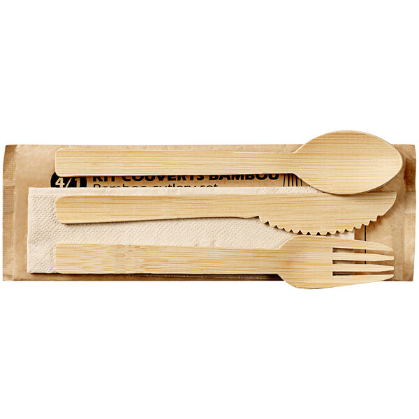 A wooden box wrapped in paper containing a set of Solia natural bamboo cutlery.