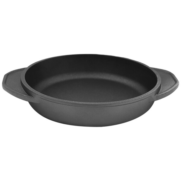 A black round cast aluminum casserole dish with two handles.