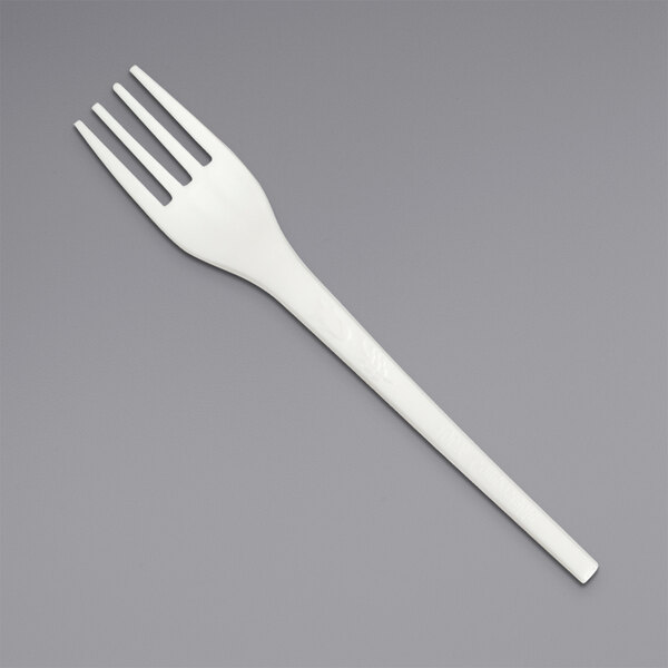 A close-up of a Solia white plastic fork.