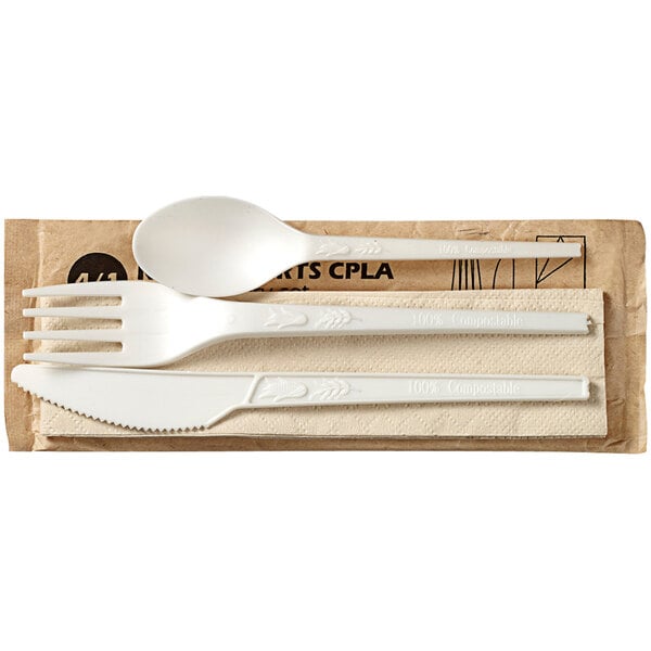 A Solia white plastic spoon and fork set wrapped in white paper with a logo.