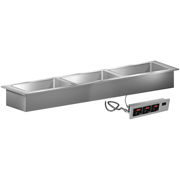 A stainless steel LTI Slimline 3 well drop-in hot food well with a power outlet.