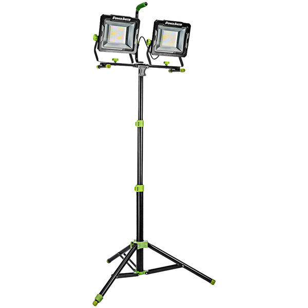 A PowerSmith dual-head LED work light on a black and green stand.