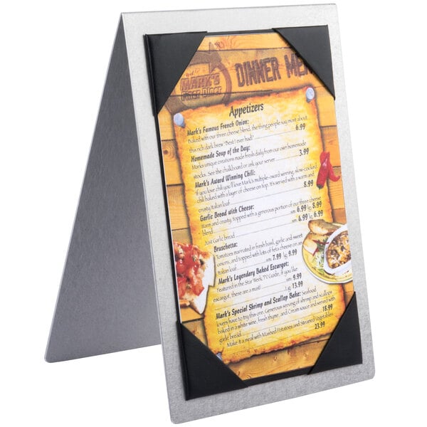 A Menu Solutions Alumitique menu tent with a picture of food on it on a table.
