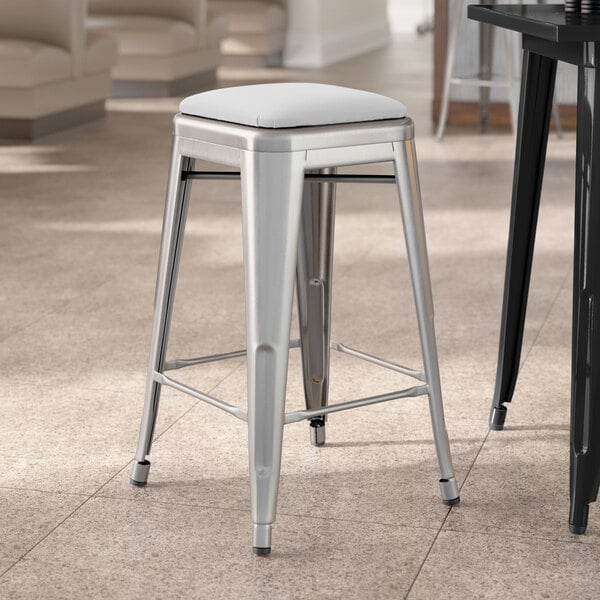 Lancaster Table & Seating Alloy Series Clear Coat Indoor Backless Counter Height Stool with White Vinyl Cushion