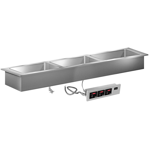 A stainless steel LTI drop-in hot food well with three compartments.
