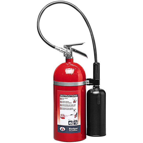 A close-up of a red Badger fire extinguisher with a black cylinder and handle.