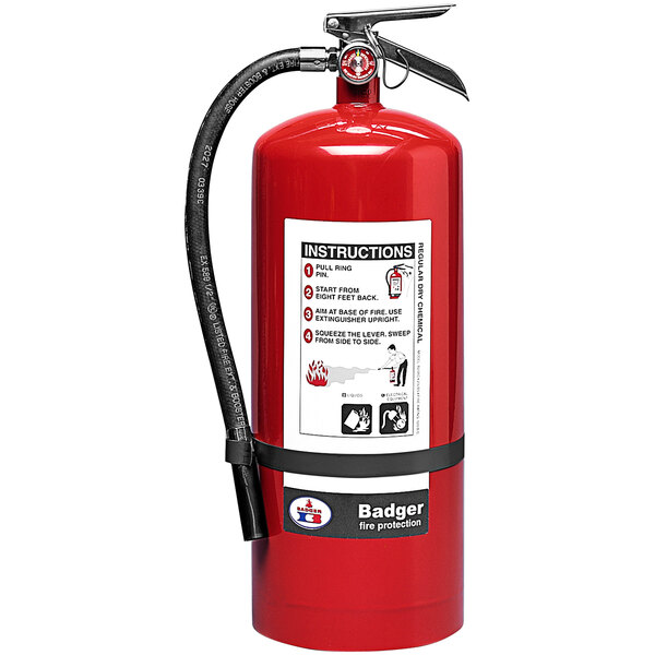 A close-up of a red Badger fire extinguisher with a black hose.