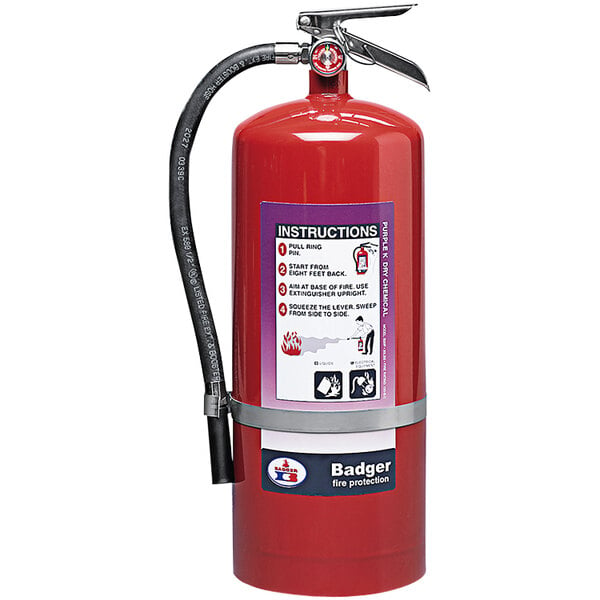 A red Badger fire extinguisher with a wall hook.