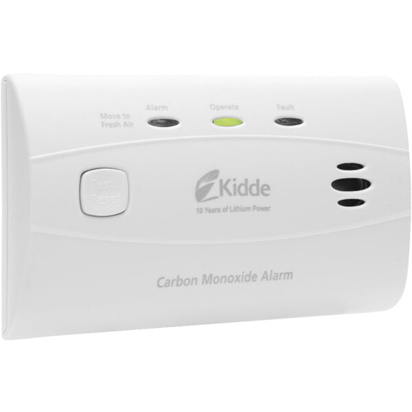 A white rectangular Kidde carbon monoxide alarm with buttons and a green and black light.