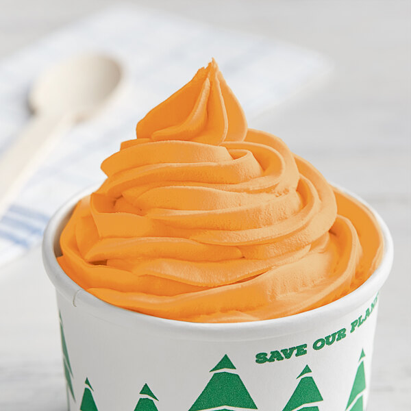 An orange frozen yogurt in a cup.
