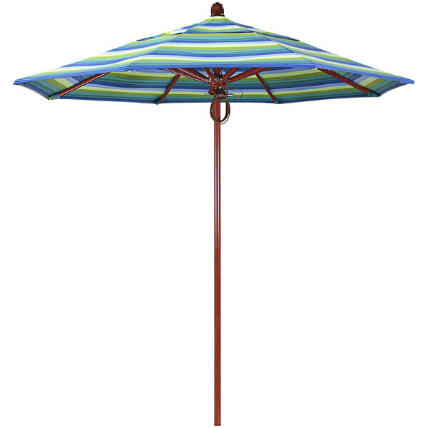 A California Umbrella with blue and green striped Seville Seaside fabric.
