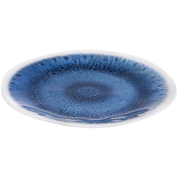 A close-up of a blue and white speckled APS Blue Ocean melamine plate with a swirl design.