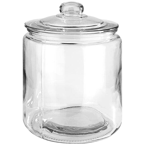An APS Classic clear glass canister with a lid.