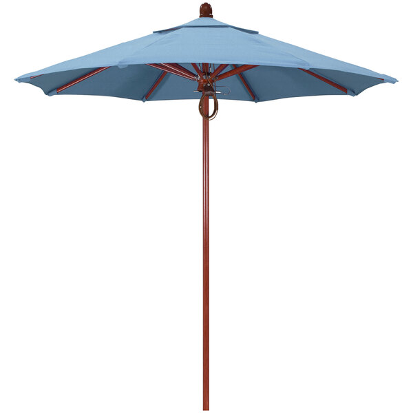 A California Umbrella blue Sunbrella canopy on a red oak pole.