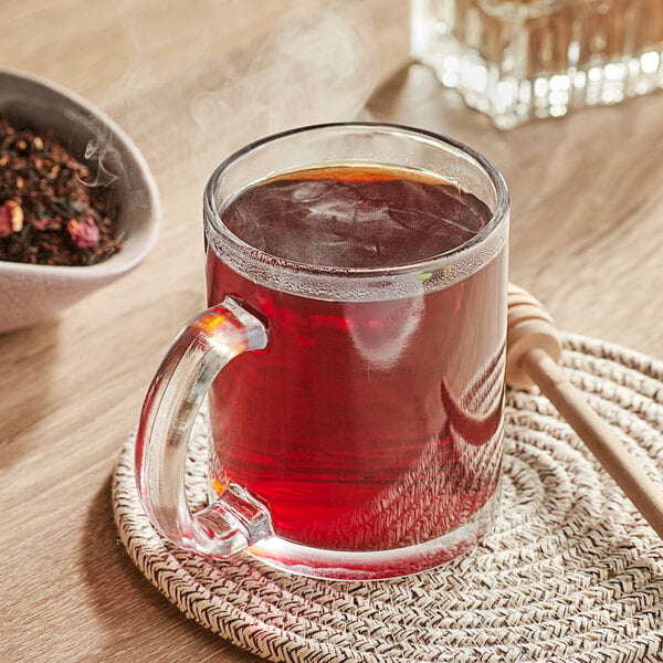 A glass mug of Davidson's Organic Strawberry Essence tea.