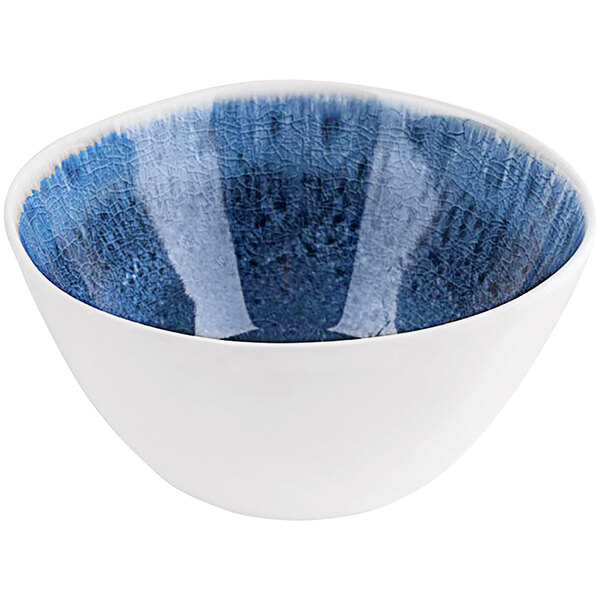 A white bowl with blue speckled inside.