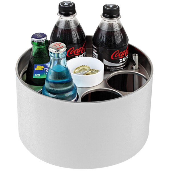A white metal round APS bottle cooler with soda bottles inside.